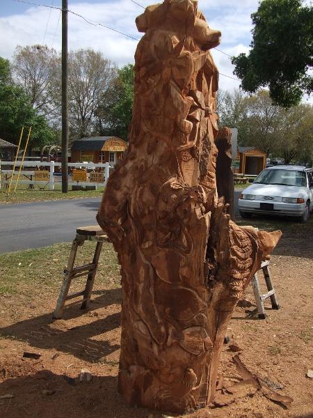 Otter with tropical fish and crab on totem sculpture