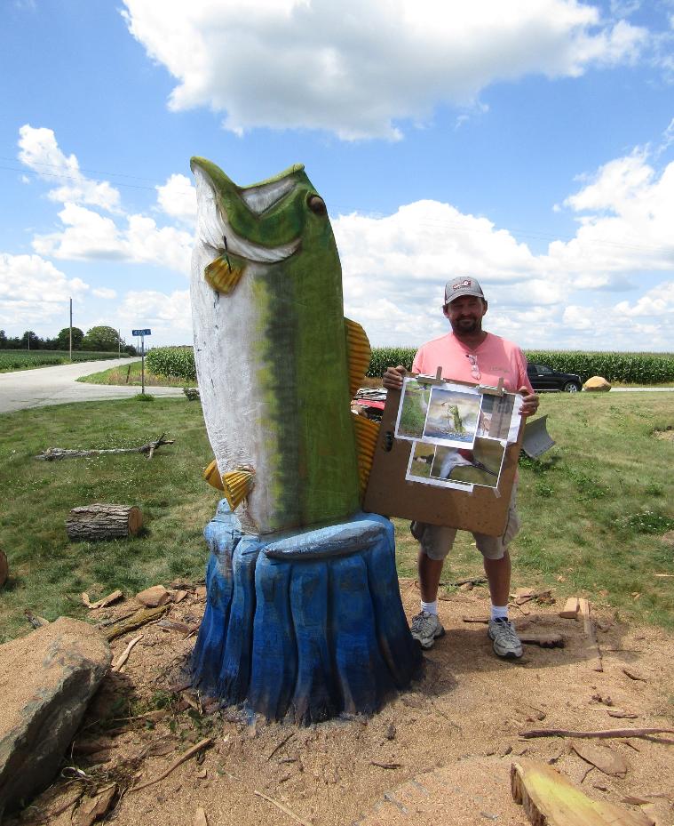 chainsaw carving of large mouth bass in tree stump Indiana