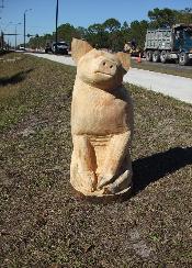 Pig chainsaw carving Florida